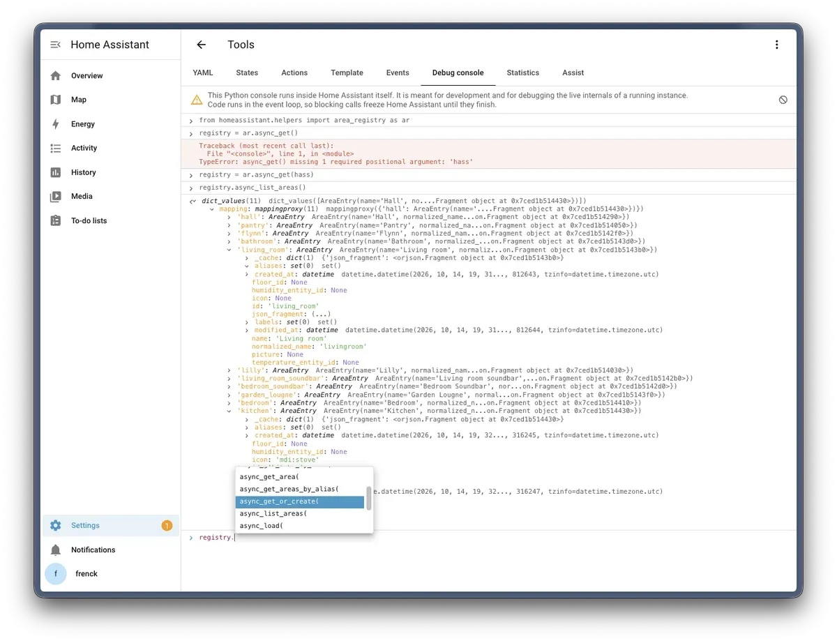 The debug console in the Tools panel, with an expanded area registry and code completion